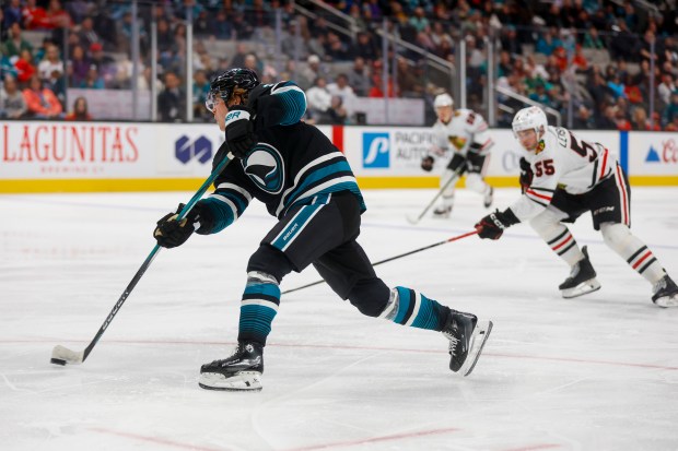 The Sharks' Will Smith takes a shot against the Blackhawks' Artyom Levshunov (55) during the third period Thursday, March 13, 2025, in San Jose, Calif. (Shae Hammond/Bay Area News Group)