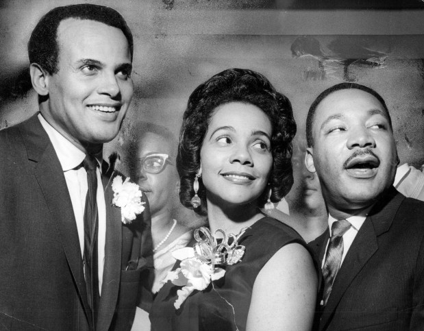 Singer Harry Belafonte, left, greets Coretta Scott King, center, and the Rev. Martin Luther King before King addressed the Chicago Freedom Festival audience on March 12, 1966, at the International Amphitheatre. Editors note: This historic print shows some hand painting in the background. (William Bender/Chicago Tribune)