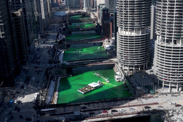 The Chicago River is dyed green in honor of St. Patrick's Day by the Chicago Plumbers Union on March 12, 2022. (John J. Kim/Chicago Tribune)