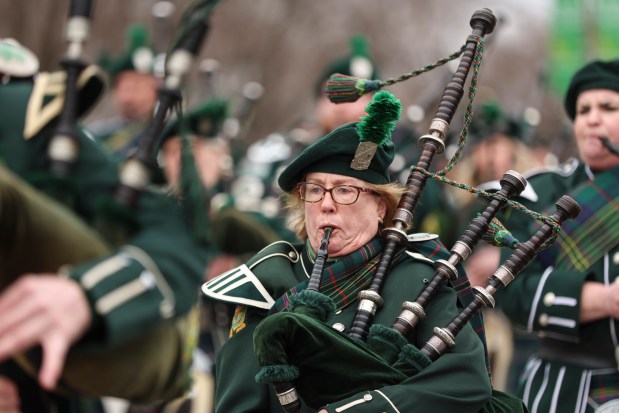 Bagpipers play during the St. Patrick's Day parade on Saturday, March 11, 2023 in Chicago. (Shanna Madison / Chicago Tribune)