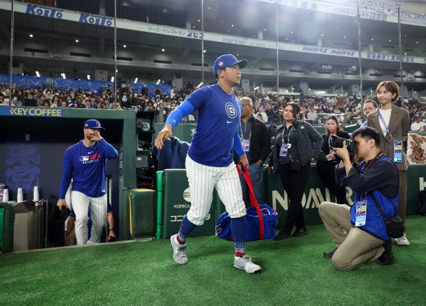 Cubs pitcher Shota Imanaga enters the field for a team workout in preparation for the Tokyo Series against the Dodgers at the Tokyo Dome on March 14, 2025, in Tokyo. (John J. Kim/Chicago Tribune)