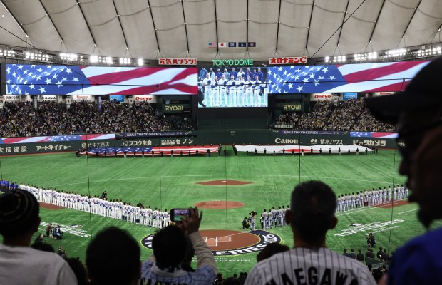 The American and Japanese national anthems are played before an exhibition game between the Cubs and Hanshin Tigers at the Tokyo Dome on March 15, 2025, in Tokyo. (John J. Kim/Chicago Tribune)