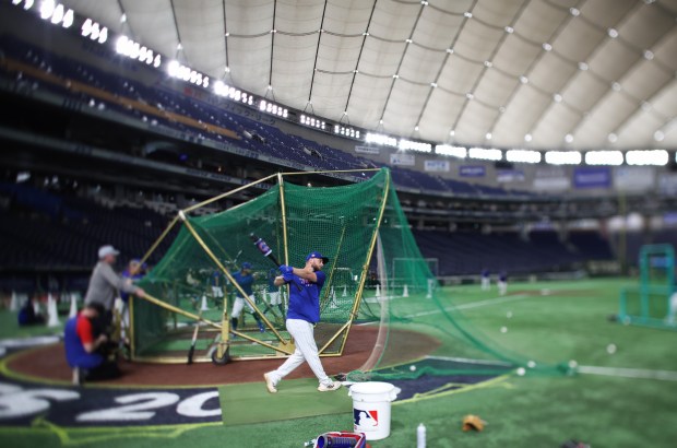 Cubs first baseman Michael Busch takes practice swings for batting practice during a workout at the Tokyo Dome on March 17, 2025, in Tokyo. The Cubs play the Dodgers on March 18 in Tokyo to start the regular season. (John J. Kim/Chicago Tribune)