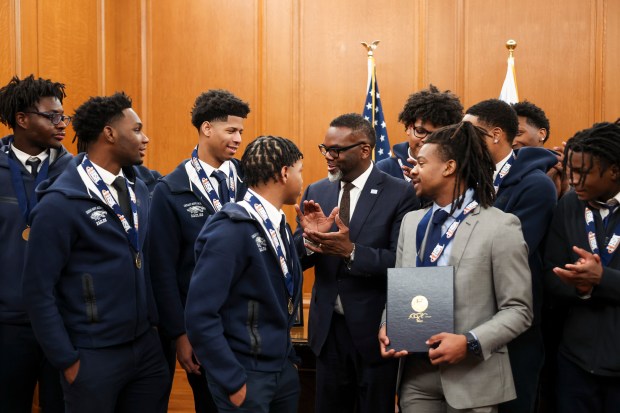 Mayor Brandon Johnson congratulates Chicago Hope Academy basketball players on their high school state championship in the mayor's ceremonial office at City Hall. (Eileen T. Meslar/Chicago Tribune)