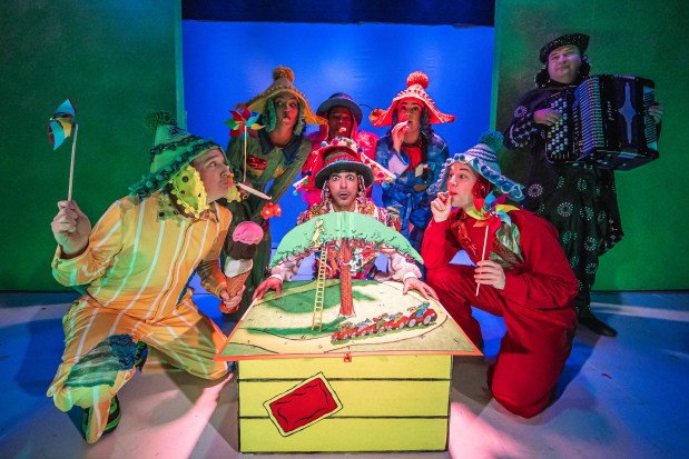 (Front, from left) Shawn Pfautsch, Jean Carlos Claudio, Tony Carter, (back, from left) Jalbelly Guzmán, Melanie Brezill and Maria Clara Ospina in Chicago Children's Theatre's world premiere of "Go Dog Go! - Ve Perro ¡Ve!" Music director Rob Witmer plays accordion. (Joe Mazza)