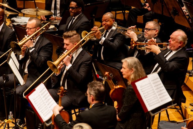 Wynton Marsalis, back row center, plays trumpet along with other members of the Jazz at Lincoln Center Orchestra during a concert with the Chicago Symphony Orchestra on April 25, 2024, at the Symphony Center. (Vincent Alban/Chicago Tribune)