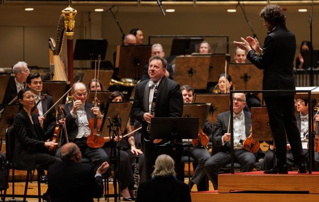 Conductor Gustavo Gimeno with principal clarinet Stephen Williamson and members of the Chicago Symphony Orchestra at the Chicago Symphony Center on March 6, 2025. (Armando L. Sanchez/Chicago Tribune)