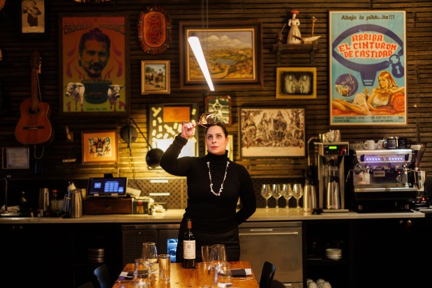 Maverick Beverage Company portfolio manager Rachel Driver Speckan stands for a portrait before hosting a wine dinner at El Che Steakhouse and Bar in Chicago on March 12, 2025. (Armando L. Sanchez/Chicago Tribune)