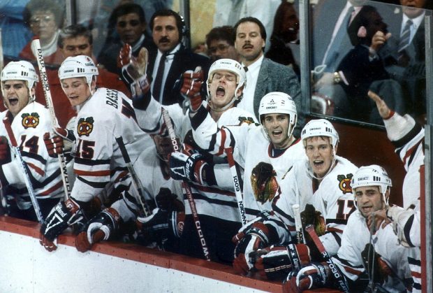 Hawks coach Mike Keenan, center, stands behind players on the bench during the final game of the season against the Maple Leafs on April 2, 1989, at Chicago Stadium. (Bob Langer/Chicago Tribune)