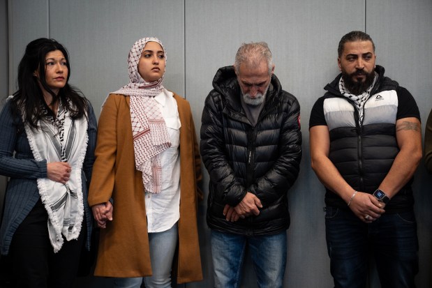 Family and supporters of Wadee Alfayoumi, including Wadee's father, right, listen during a press conference after a jury found Joseph Czuba guilty on all charges in the hate crime murder of the Plainfield six-year-old at the Will County Courthouse on Feb. 28, 2025. (E. Jason Wambsgans/Chicago Tribune)