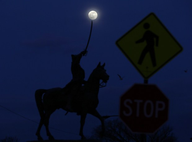 A waxing gibbous moon rises above a statue of Tadeusz Kosciuszko on East Solidarity Drive on Jan. 9, 2020, in Chicago. Kosciuszko was an 18th century Polish-Lithuanian military leader. (John J. Kim/Chicago Tribune)