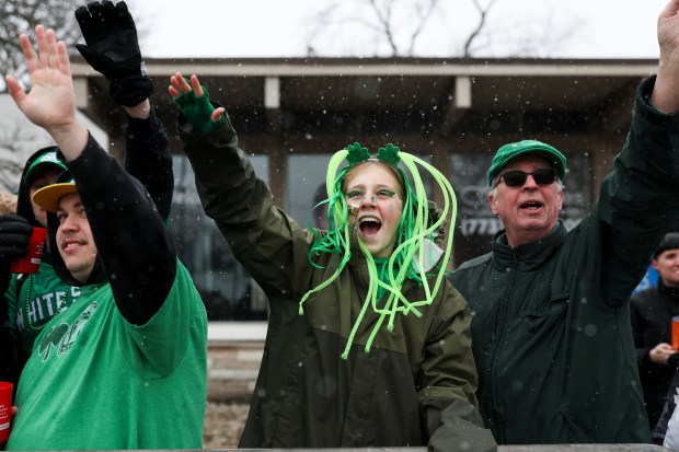 People yell for candy during the South Side Irish Parade on March 16, 2025. (Eileen T. Meslar/Chicago Tribune)