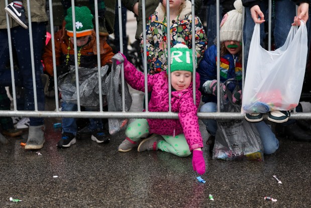 Shannon Estand reaches for candy during the South Side Irish Parade in Beverly and Morgan Park on March 16, 2025. (Eileen T. Meslar/Chicago Tribune)