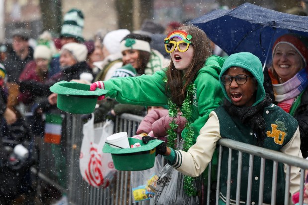 People yell for candy during the South Side Irish Parade in Beverly and Morgan Park on March 16, 2025. (Eileen T. Meslar/Chicago Tribune)