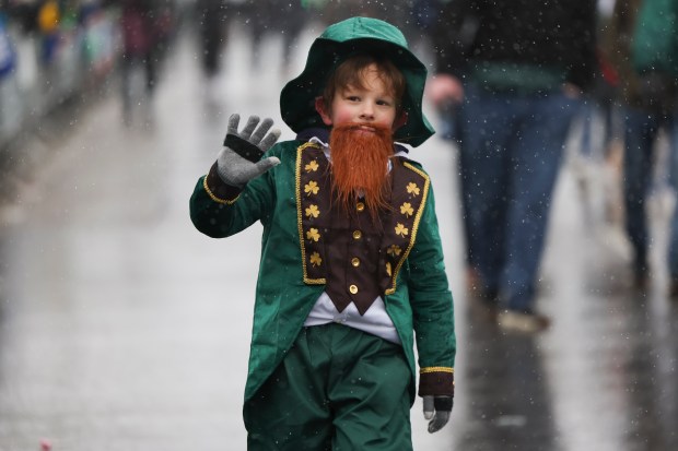 Hugo Bauer, 7, marches on Western Avenue in the South Side Irish Parade. (Eileen T. Meslar/Chicago Tribune)