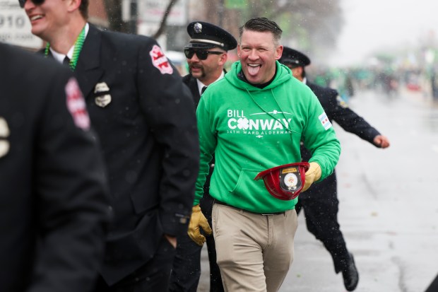 Ald. William Conway, 34th, marches on Western Avenue in the South Side Irish Parade. (Eileen T. Meslar/Chicago Tribune)