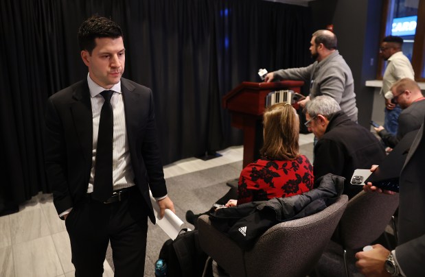 Chicago Blackhawks general manager Kyle Davidson exits a press conference after the team announced that veteran forward Corey Perry was waived due to unacceptable misconduct according to the Blackhawks. Davidson spoke to the media before a game against the Seattle Kraken at the United Center in Chicago on Nov. 28, 2023. (Chris Sweda/Chicago Tribune)