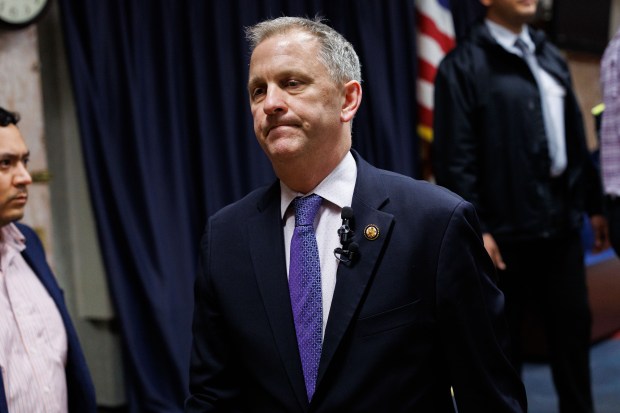 U.S. Rep. Sean Casten leaves the stage after being confronted by pro-Palestinian and pro-Israel disrupters at his town hall meeting at American Legion Post 80, March 19, 2025, in Downers Grove. (Armando L. Sanchez/Chicago Tribune)