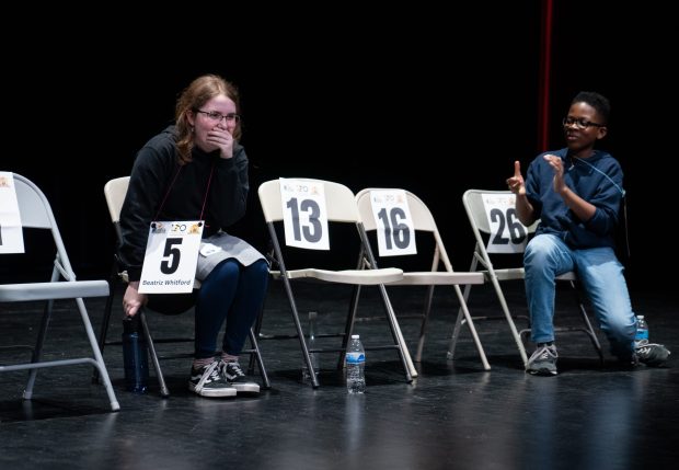 Beatriz Whitford-Rodriguez, left, 13, of Skinner North Classical School reacts after winning the 2025 Citywide Spelling Bee Championship, alongside Kwame Boateng, of McDade Classical School, at Curie Metropolitan High School on March 13, 2025. (Audrey Richardson/Chicago Tribune)