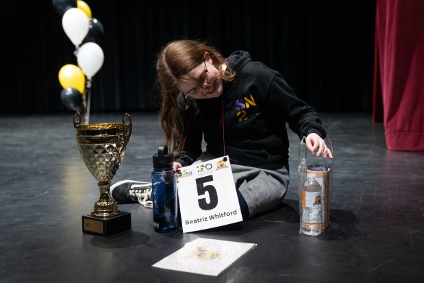 Beatriz Whitford-Rodriguez, 13, of Skinner North Classical School reacts after winning the 2025 Citywide Spelling Bee Championship at Curie Metropolitan High School. (Audrey Richardson/Chicago Tribune)