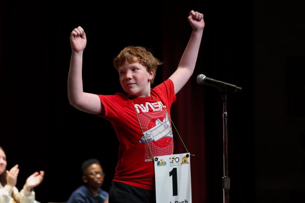 Zach Bush, of Nettlehorst Elementary, reacts after spelling a word correctly during the 2025 Citywide Spelling Bee Championship. (Audrey Richardson/Chicago Tribune)