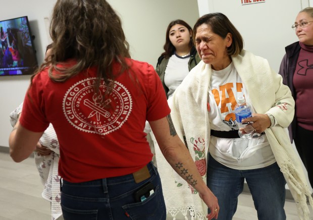 A Paz Elementary School parent reacts following the Chicago Board of Education voted to keep open a number of Acero schools while keeping open two others through the 2025-2026 school year. The vote took place at CPS Headquarters on Thursday, Feb. 27, 2025. Paz was one of two schools left in limbo, staying open through the 2025-2026 school year for now. (Chris Sweda/Chicago Tribune)