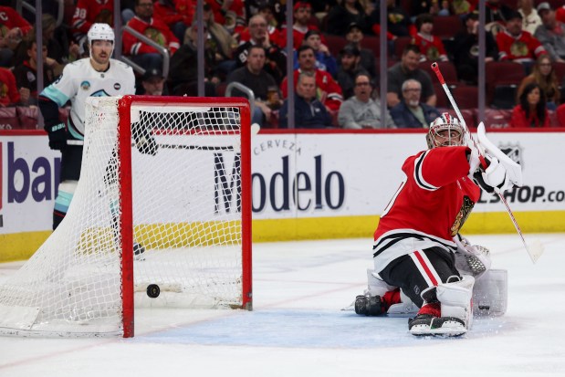 Chicago Blackhawks goaltender Spencer Knight (30) looks back as Seattle Kraken right wing Jordan Eberle (7) scored a goal during the second period at the United Center Tuesday March 18, 2025, in Chicago. (Armando L. Sanchez/Chicago Tribune)