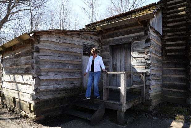 New Salem Lincoln League President, Gina Gilmore-Wolter stands outside her 4th great uncle's residence, the Lukins-Ferguson residence, during a media tour, March 10, 2025, in Petersburg of the Lincoln's New Salem State Historic Site. (Antonio Perez/Chicago Tribune)