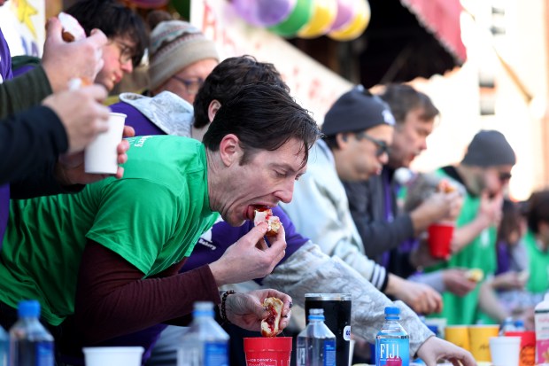 Jeff Trzaskus participates in the annual paczki eating contest at Bennison's Bakery in Evanston on March 1, 2025. (Chris Sweda/Chicago Tribune)