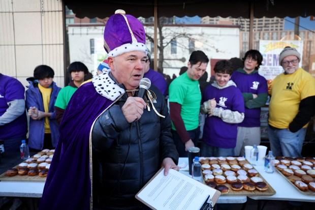 Bennison's Bakery owner Jory Downer gives out the rules prior to the annual paczki eating contest at his Evanston business on March 1, 2025. (Chris Sweda/Chicago Tribune)