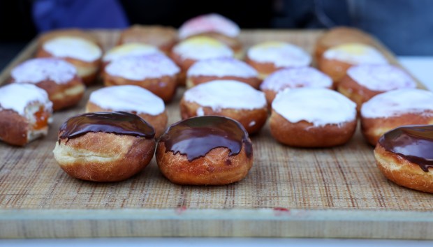 Paczki are laid out on a tray during the annual paczki eating contest at Bennison's Bakery in Evanston on March 1, 2025. (Chris Sweda/Chicago Tribune)