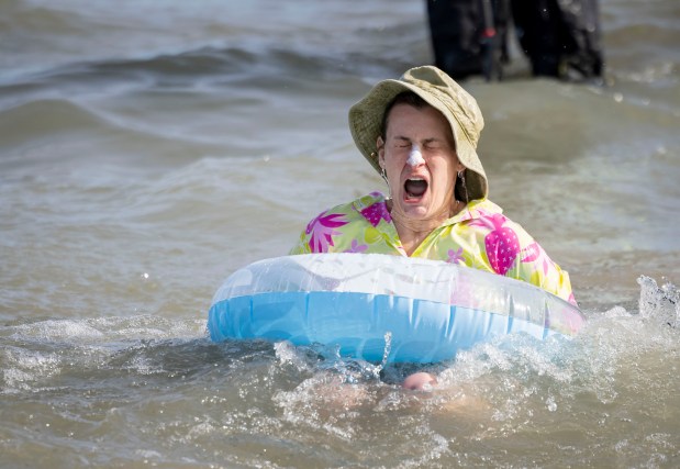 A participant dives into Lake Michigan with temperatures in the 20s on March 2, 2025, at North Avenue Beach during the annual Polar Plunge benefitting Special Olympics Illinois. (Brian Cassella/Chicago Tribune)