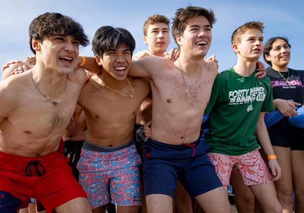 Participants prepare to run into Lake Michigan with temperatures in the 20s on March 2, 2025, during the annual Polar Plunge. (Brian Cassella/Chicago Tribune)