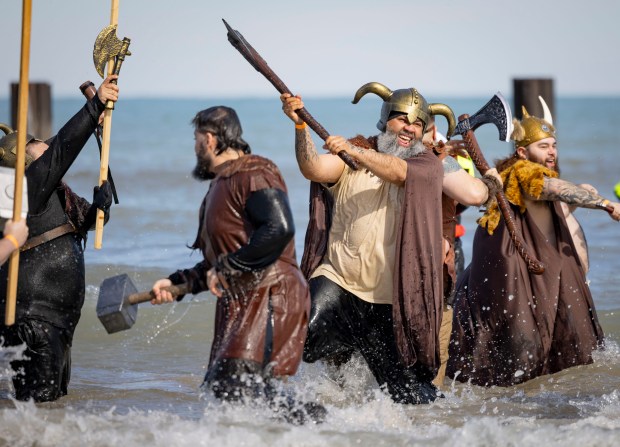 Participants stage a battle in Lake Michigan with temperatures in the 20s on March 2, 2025. (Brian Cassella/Chicago Tribune)