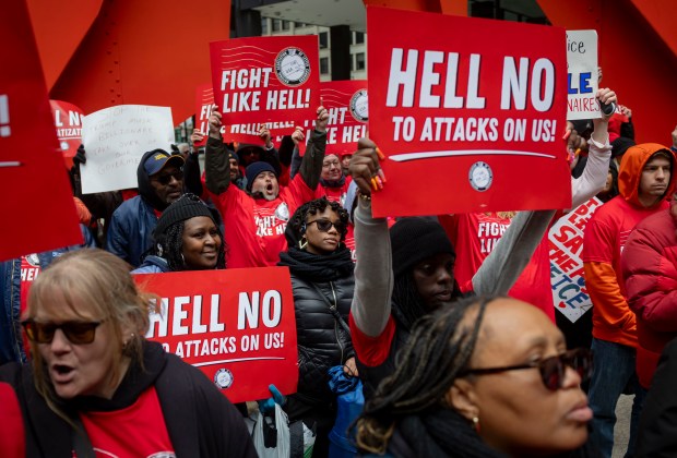 Workers and supporters cheer as the National Association of Letter Carriers hosts a rally to save the U.S. Postal Service on March 23, 2025, in Federal Plaza. (Brian Cassella/Chicago Tribune)