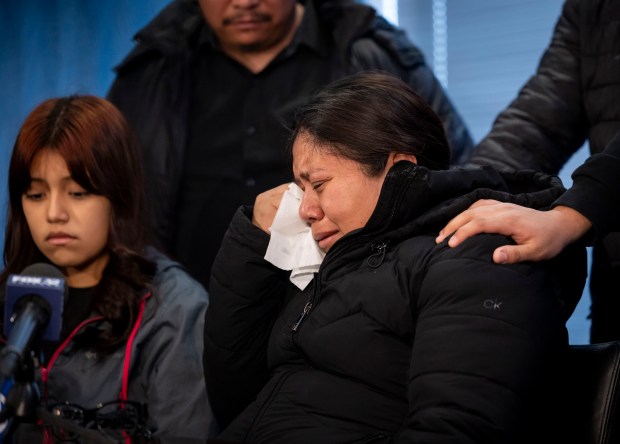 Fabiola Pacheco Delacruz becomes emotional while speaking about her daughter, Zulma Daniela Calderon Pacheco, alongside Zulma's sister, Melanie Calderon, left, March 18, 2025, at the offices of Cavanagh Sorich Law Group where her family announced a lawsuit against Mansion Live and security guard charged in her death. (Brian Cassella/Chicago Tribune)