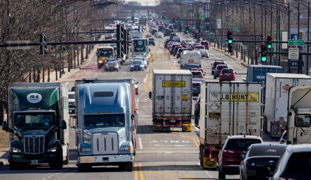 Trucks and other vehicles travel through the intersection of South 41st Street and Pulaski Road on March 12, 2025, on Chicago's Southwest Side. (Brian Cassella/Chicago Tribune)