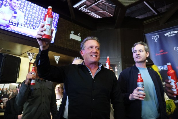 Former Chicago Blackhawks player Jeremy Roenick hoists a beer with fans during the 27th annual toast to the late broadcaster Harry Caray and a ceremony to break a purported White Sox "curse" at Harry Caray's Tavern on Tuesday, March 18, 2025. (Terrence Antonio James/Chicago Tribune)