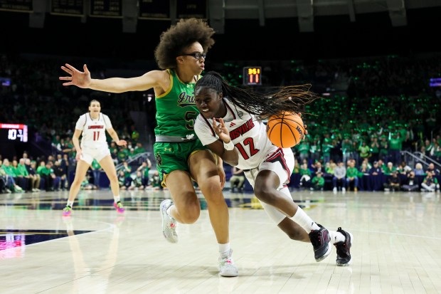 Notre Dame Fighting Irish guard Olivia Miles (5) guards Louisville Cardinals guard Ja'Leah Williams (12) during the first quarter at Purcell Pavilion in South Bend on Sunday, March 2, 2025. (Eileen T. Meslar/Chicago Tribune)