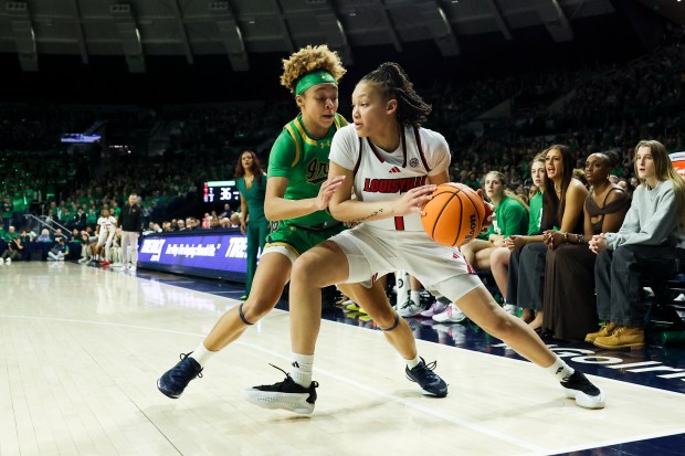 Notre Dame Fighting Irish guard Hannah Hidalgo (3) guards Louisville Cardinals guard Imari Berry (1) during the second quarter at Purcell Pavilion in South Bend on Sunday, March 2, 2025. (Eileen T. Meslar/Chicago Tribune)