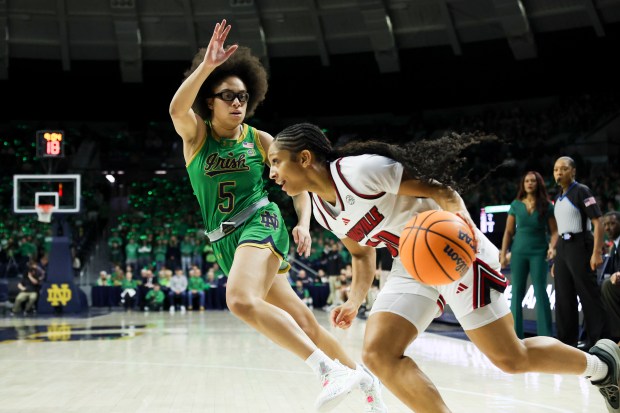 Notre Dame Fighting Irish guard Olivia Miles (5) guards Louisville Cardinals guard Jayda Curry (30) during the first quarter at Purcell Pavilion in South Bend on Sunday, March 2, 2025. (Eileen T. Meslar/Chicago Tribune)