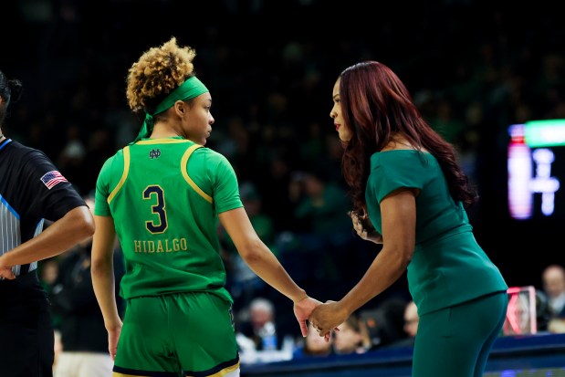 Notre Dame Fighting Irish guard Head Coach Niele Ivey speaks to Notre Dame Fighting Irish guard Hannah Hidalgo (3) during the third quarter at Purcell Pavilion in South Bend on Sunday, March 2, 2025. (Eileen T. Meslar/Chicago Tribune)