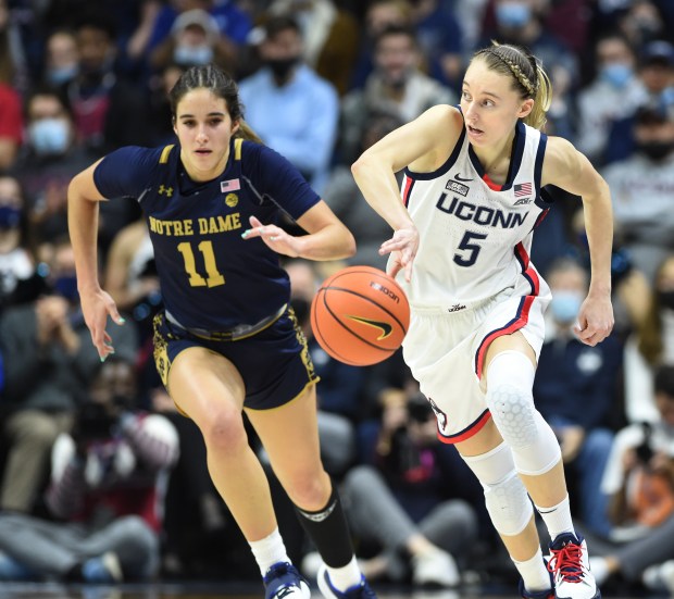 STORRS 12/05/21 UConn's Paige Bueckers (5) drives down the court after stealing the ball from Notre Dame's Sonia Citron (11) in the second half at Gampel Pavilion. Bueckers had a game-high 22 points and five steals in UConn's 73-54 win. Photo by Cloe Poisson/Special to the Courant