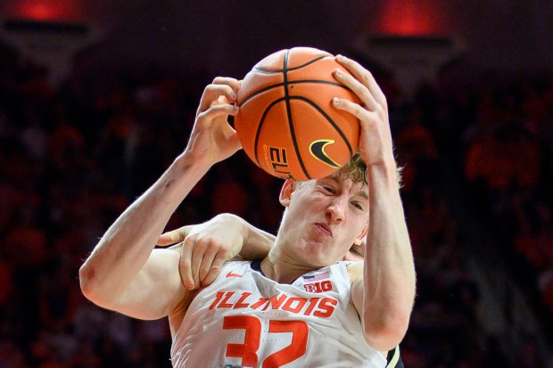 Illinois' Kasparas Jakučionis grabs a rebound during a game against Purdue on March 7, 2025, in Champaign. (Craig Pessman/AP)