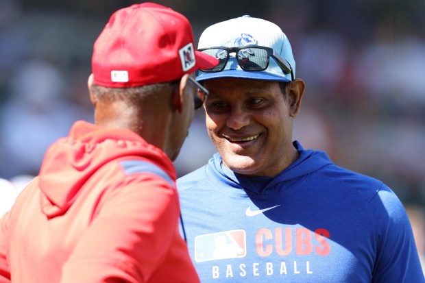 Cubs guest instructor Sammy Sosa, right, talks with Angels manager Ron Washington before a Cactus League game on Feb. 27, 2025, at Sloan Park in Mesa, Ariz. (Chris Coduto/Getty Images)