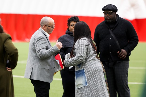 Paul Cadwell, Chicago Fire FC's Senior Vice President, Community Programs, left, speaks to Mary Baggett, president of the ABLA Local Advisory Council, CHA's resident board for the Near West Side community, before the ribbon cutting event for Endeavor Health Performance Center in the Near West Side on March 3, 2025. (Eileen T. Meslar/Chicago Tribune)