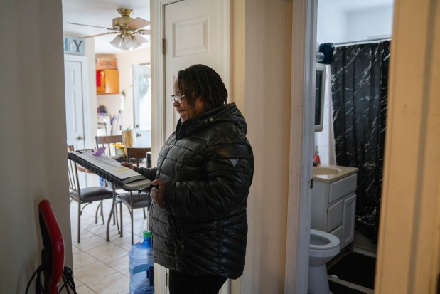 Sabrina Agee, of the Waukegan Housing Authority, performs an annual inspection on a rental unit held by a voucher holder in Waukegan on March 4, 2025. Local lease-up rates are improving thanks to expanded jurisdiction and the recruitment of new landlords with the help of monetary incentives. (Audrey Richardson/Chicago Tribune)