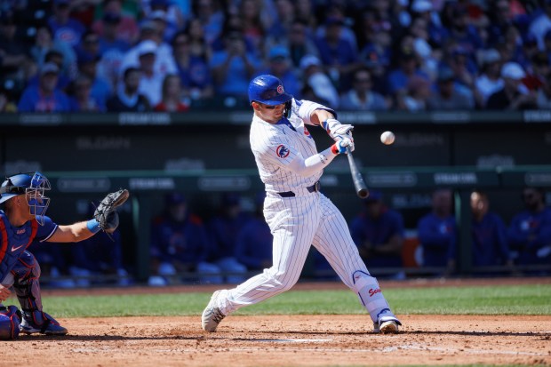 Cubs' Seiya Suzuki hits a fly-out during the third inning against the Dodgers at spring training at Sloan Park on Feb. 21, 2025, in Mesa, Ariz. (Armando L. Sanchez/Chicago Tribune)