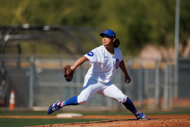 Chicago Cubs pitcher Shota Imanaga (18) throws against Chicago Cubs infielder Justin Turner (3) during live batting practice at spring training at Sloan Park Friday Feb. 21, 2025, in Mesa, Arizona. (Armando L. Sanchez/Chicago Tribune)