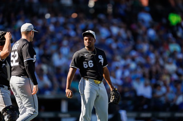 Chicago White Sox pitcher Prelander Berroa (66) looks at Chicago White Sox pitching coach Ethan Katz (52) before being taken out of the game during the fourth inning against the Chicago Cubs at spring training at Sloan Park Saturday Feb. 22, 2025, in Mesa, Arizona. (Armando L. Sanchez/Chicago Tribune)